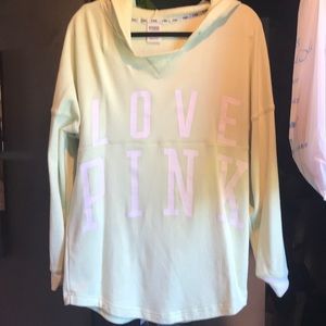 Long and loose fitting hooded sweatshirt